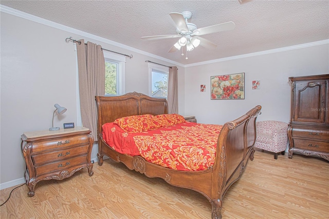 bedroom featuring a textured ceiling, light wood-type flooring, ceiling fan, and ornamental molding