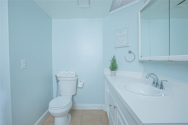 bathroom with tile patterned floors, vanity, and toilet