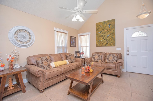 tiled living room featuring ceiling fan, high vaulted ceiling, and a healthy amount of sunlight