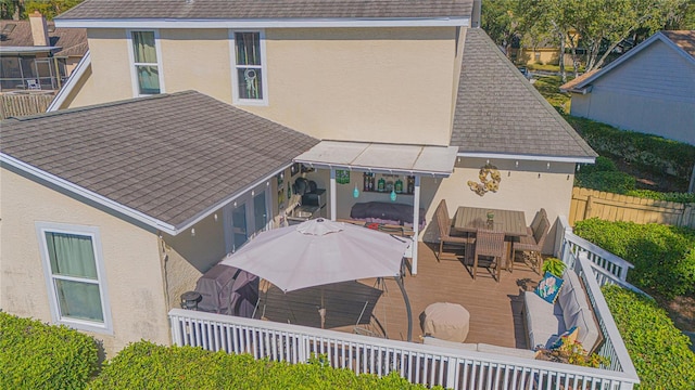 back of house featuring a wooden deck