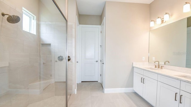 bathroom featuring vanity and a tile shower