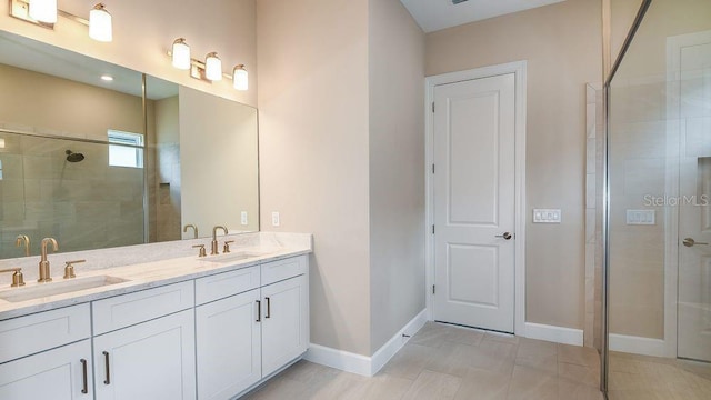 857 Arbor Green Trl, Saint Cloud, FL 34771 - bathroom featuring double vanity, baseboards, and tiled shower