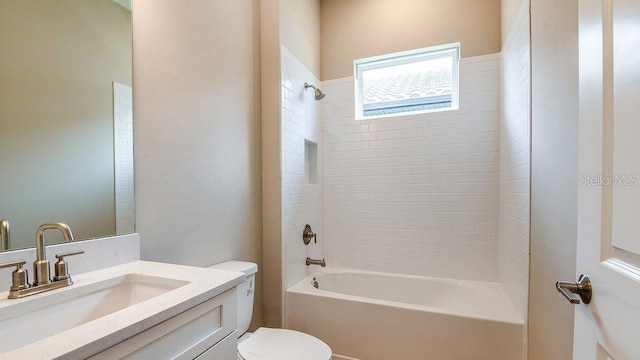 full bathroom with vanity, toilet, and tiled shower / bath