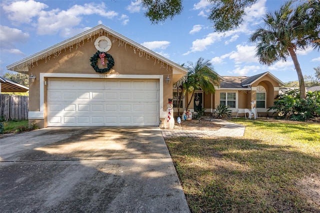 ranch-style home featuring a front yard and a garage