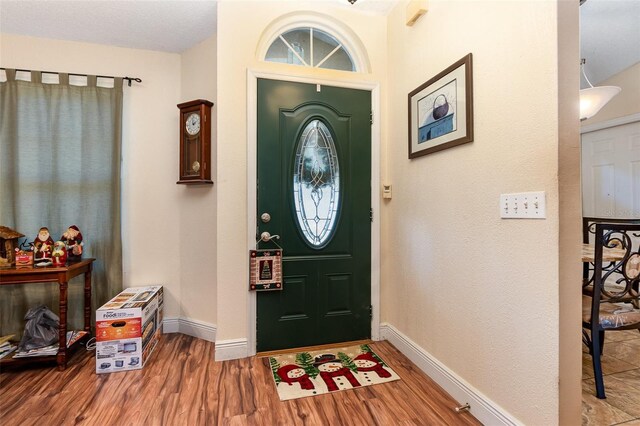 entrance foyer featuring hardwood / wood-style floors