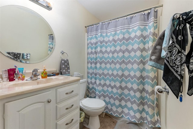 bathroom with curtained shower, tile patterned flooring, vanity, and toilet