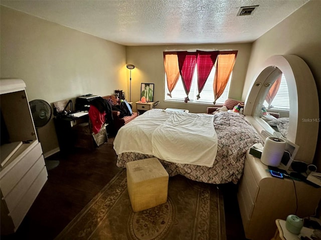 bedroom featuring a textured ceiling