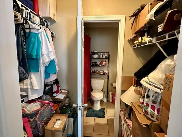 walk in closet featuring tile patterned flooring