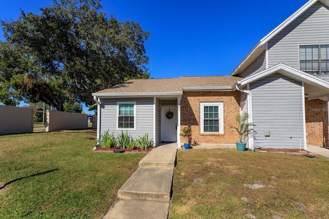 view of front of home with a front lawn