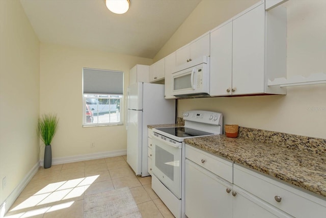 kitchen with white cabinets, lofted ceiling, white appliances, and light tile patterned floors