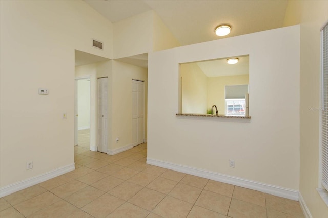 tiled empty room with sink