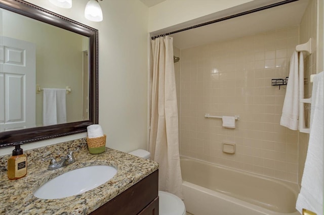 full bathroom featuring shower / bath combo, vanity, and toilet