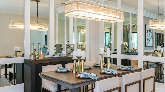 interior space featuring ornamental molding and an inviting chandelier