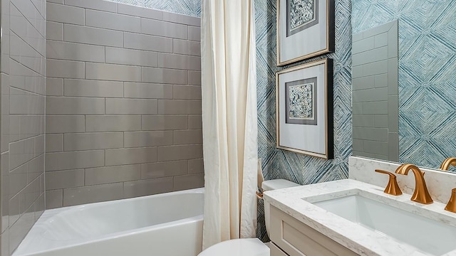 full bathroom featuring vanity, shower / bathtub combination with curtain, and toilet