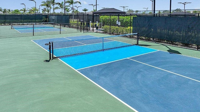 view of sport court with basketball hoop