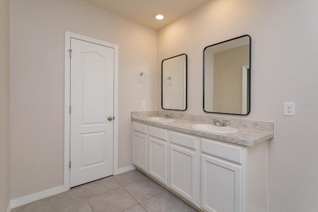 bathroom with tile patterned flooring and vanity