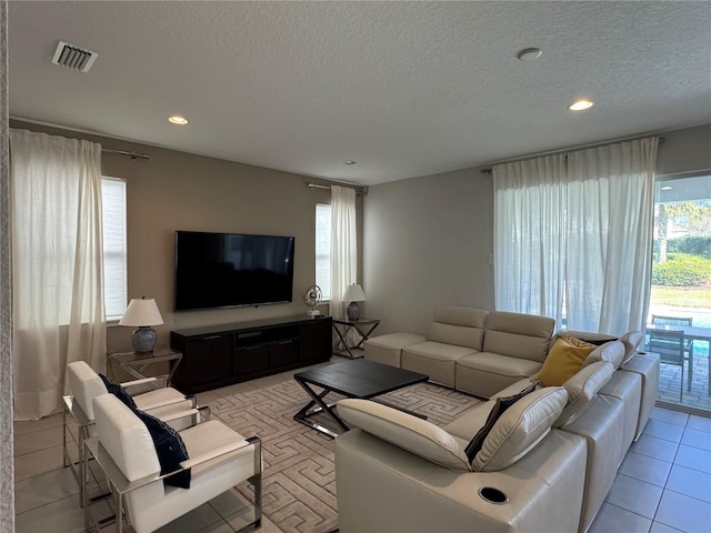 living room with a textured ceiling