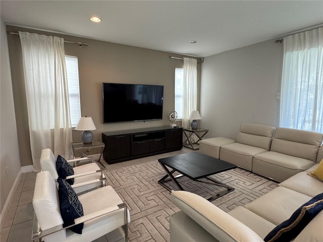 living room featuring light tile patterned floors and plenty of natural light