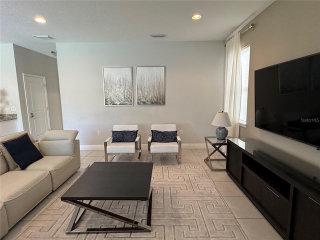 tiled living room with a textured ceiling