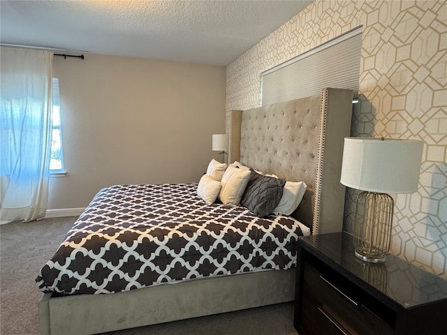 carpeted bedroom with a textured ceiling