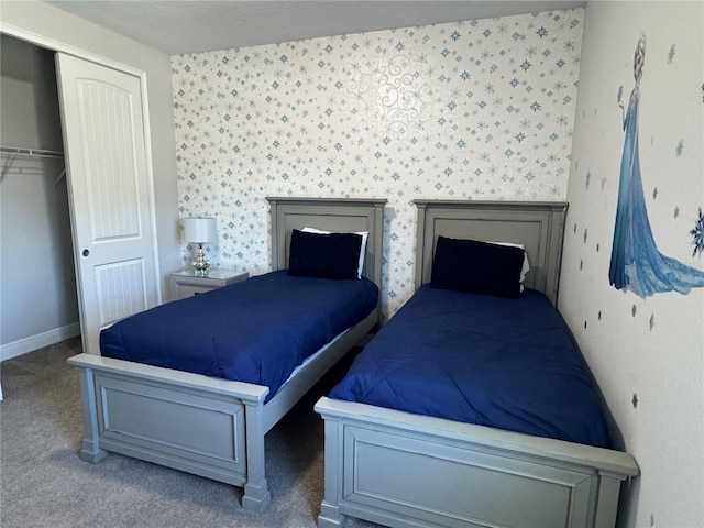 bedroom featuring carpet and a closet