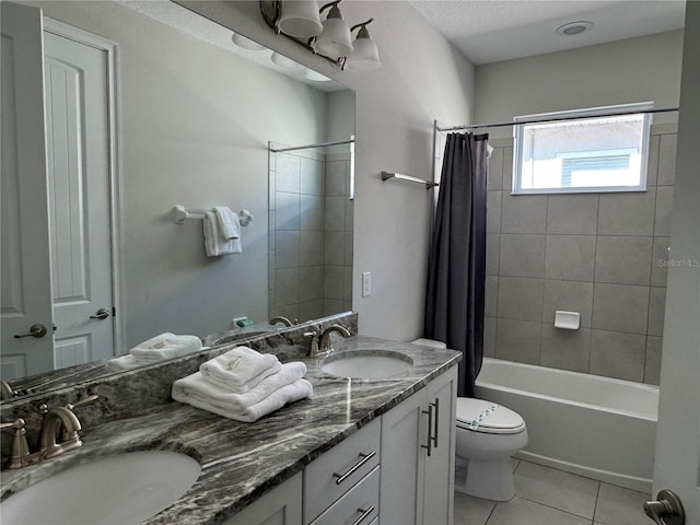 full bathroom with tile patterned flooring, vanity, toilet, and shower / bath combo with shower curtain