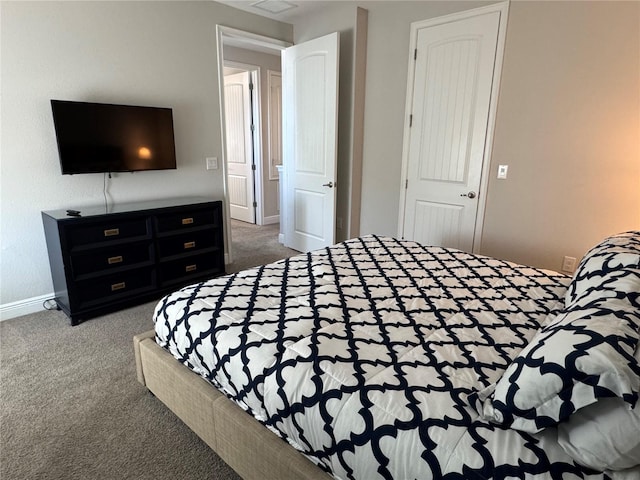 bedroom with carpet and a closet