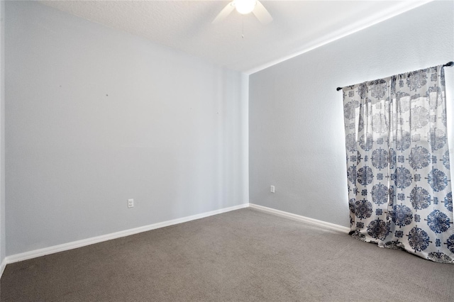 carpeted spare room with ceiling fan and a textured ceiling