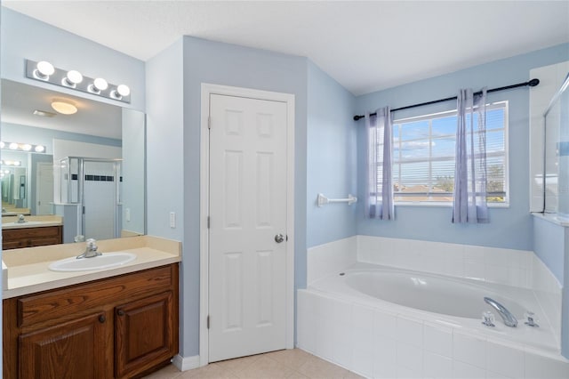 bathroom featuring tile patterned floors, vanity, and independent shower and bath