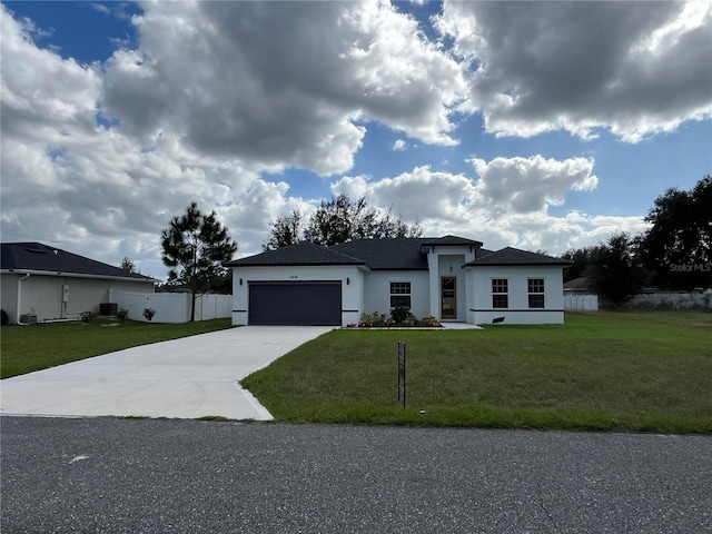 view of front of home featuring a garage and a front lawn