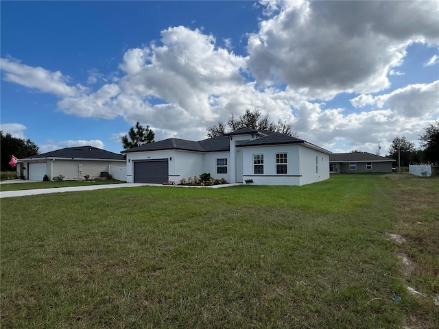 single story home with a front lawn and a garage