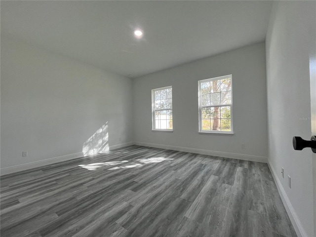 spare room featuring dark hardwood / wood-style floors