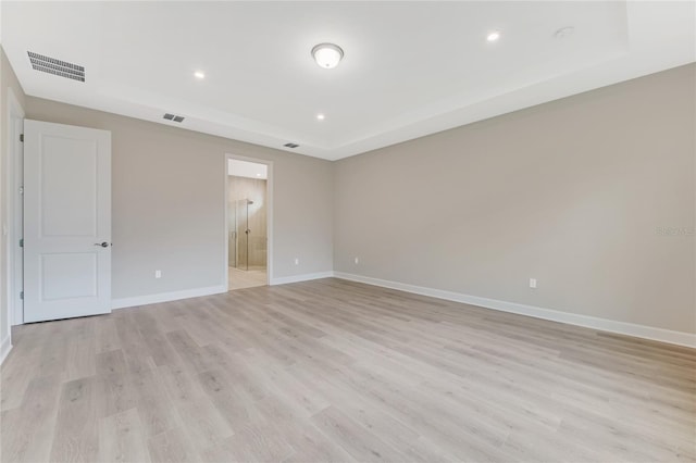 spare room featuring light hardwood / wood-style floors