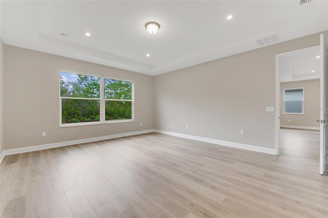 empty room with light hardwood / wood-style floors