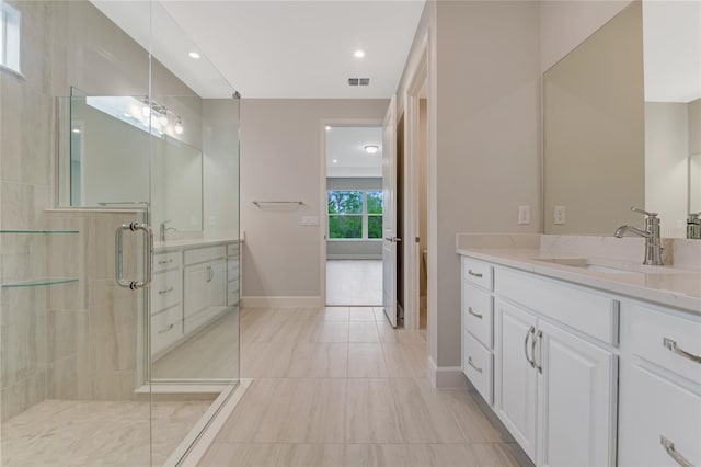 bathroom with vanity and walk in shower