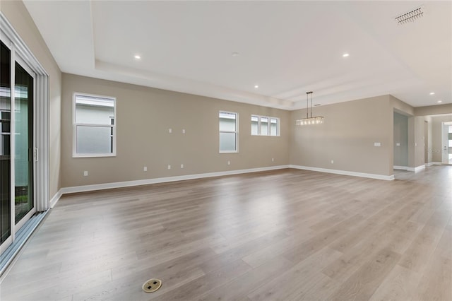 spare room with light wood-type flooring