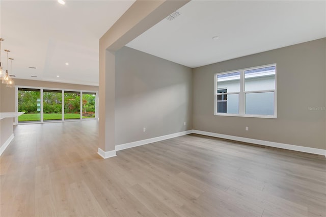 unfurnished room with light hardwood / wood-style floors