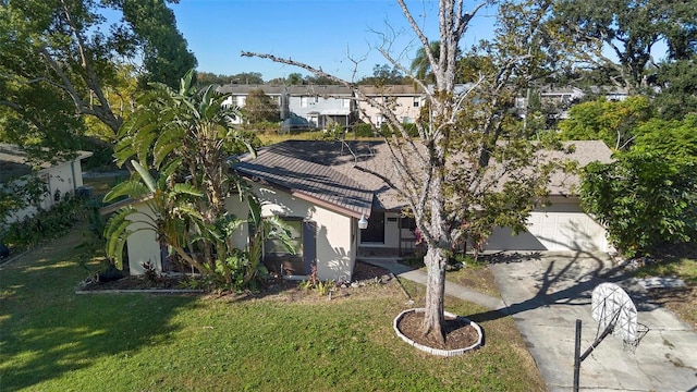 exterior space featuring a garage and a front lawn