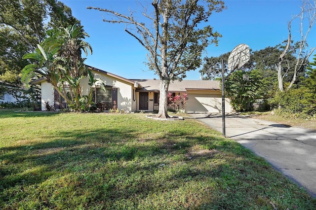 view of front of house featuring a garage and a front lawn