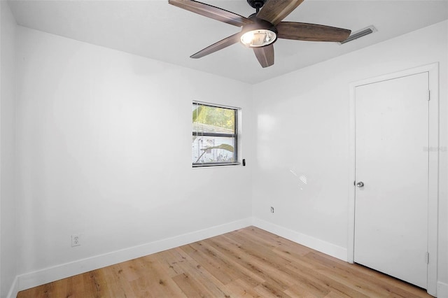 spare room featuring ceiling fan and light hardwood / wood-style floors