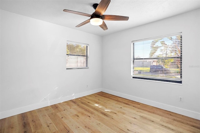 empty room featuring light hardwood / wood-style floors and ceiling fan