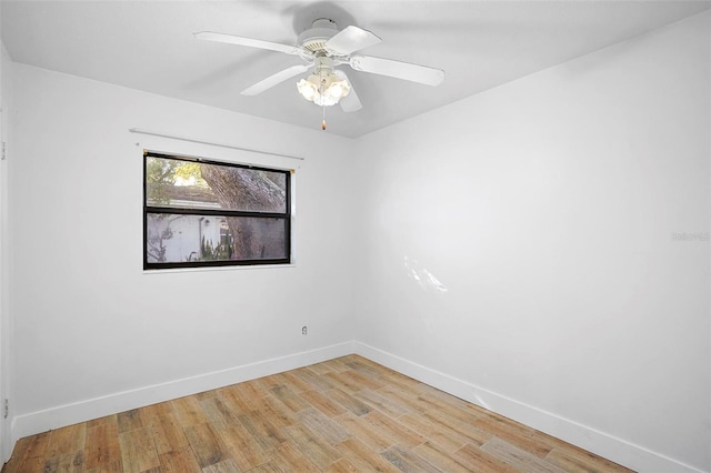 spare room featuring ceiling fan and light wood-type flooring