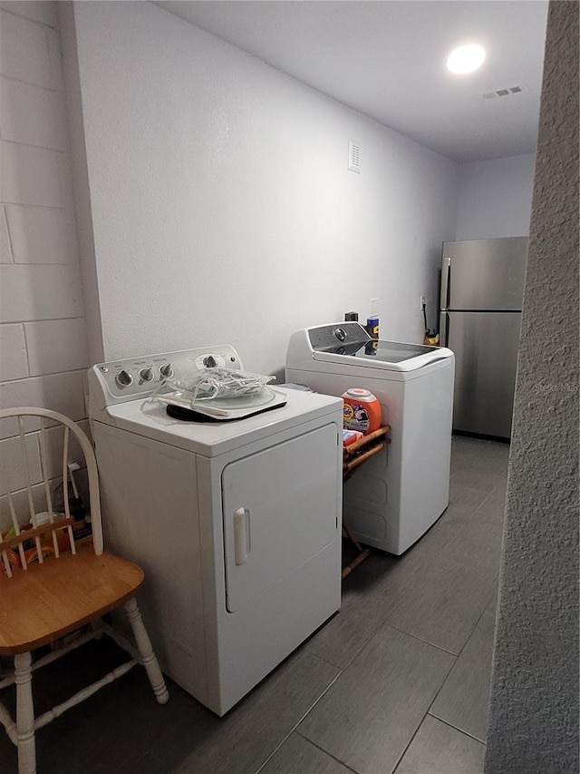 laundry area with washer and clothes dryer