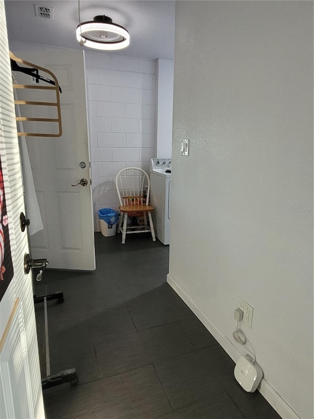 clothes washing area featuring washer / clothes dryer