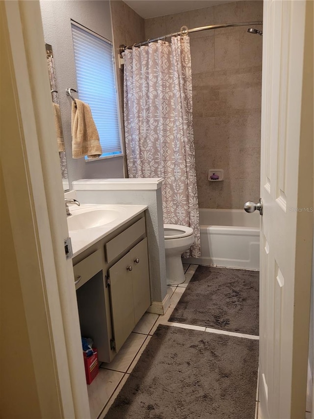 full bathroom with tile patterned floors, vanity, shower / bath combo, and toilet