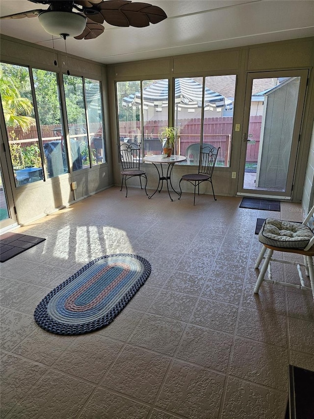 sunroom / solarium with ceiling fan