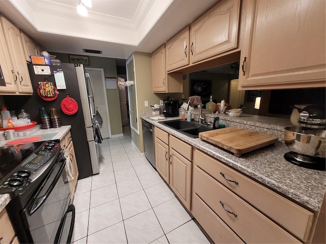 kitchen with black appliances, sink, crown molding, light tile patterned floors, and a tray ceiling