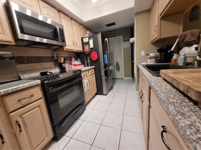 kitchen featuring decorative backsplash, appliances with stainless steel finishes, ornamental molding, light brown cabinets, and light tile patterned flooring