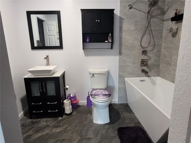 full bathroom with vanity, toilet, and tiled shower / bath