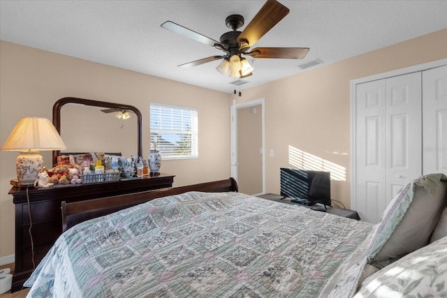 bedroom featuring ceiling fan and a closet